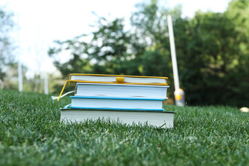 Books on the grass in the park