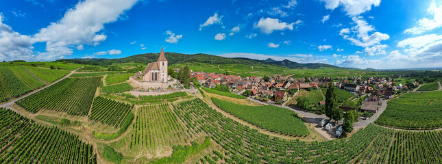 Aerial flyover view of the beautiful French Village of Hunawihr in Alsace France	
