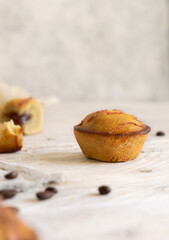 Pasticciotto leccese pastry filled with egg custard cream on a wooden table close up