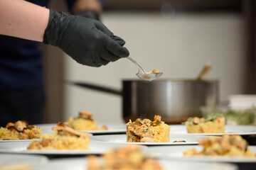 preparation of paella with chicken and mussels