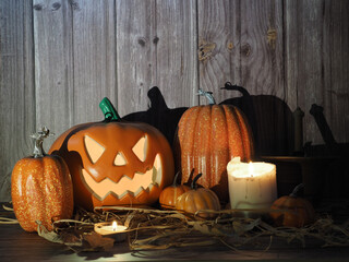 Obraz premium Halloween pumpkin head lantern on wooden background