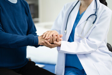 Female doctors shake hands with patients encouraging each other  To offer love, concern, and encouragement while checking the patient's health.