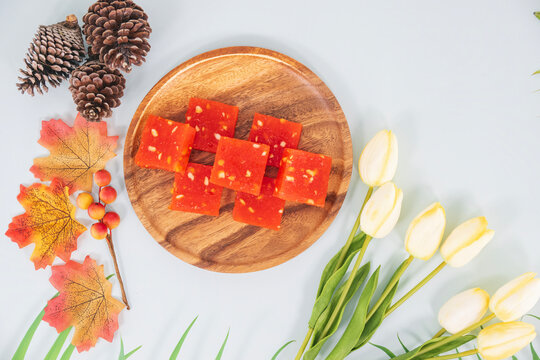 Bombay Halwa is an popular Indian dessert served in a plate and decorated. Bombay halwa desert in an isolated background. Indian Festival sweet dish.