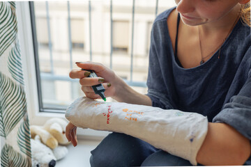 Fun creative fun to draw on plaster cast on broken arm