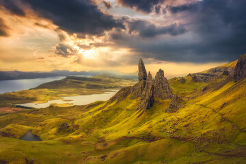 Panoramic view from above of The Old Man of Storr at sunrise. View over Old Man Of Storr during a beautiful sunrise and dramatic sky. Isle of Skye, Trotternish, Scotland, UK - obrazy, fototapety, plakaty