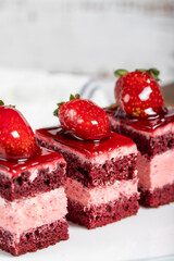 Small slices of cake. Strawberry and cream cake slices on a plate. snack sweet food. Close up