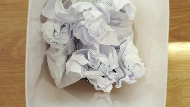 The close-up shots of throwing the crumpled paper, hinting at the feeling of hopelessness, failure, error, mistake, rejection and discard idea. It also shows the importance of recycling and reuse. 