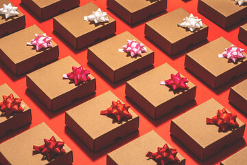 Kraft paper gift boxes flat lay on red background