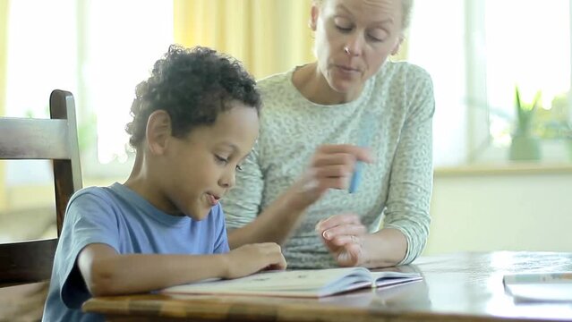 back to school teacher with child reading a book together with people stock image stock video