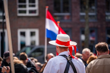 traditional dutch carrier with hat at alkmaar cheese market