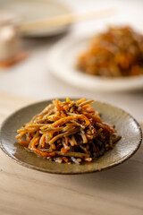 Kinpira gobo, a traditional Japanese dish made from minced burdock stewed in sugar and soy sauce.
