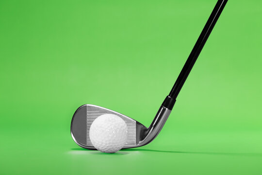 Fairway Iron Golf Club on a Green Background with Copy Space