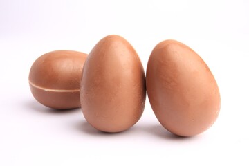 Sveti Vlas, Bulgaria - June 27, 2023: Unwrapped Kinder Surprise Eggs isolated on white