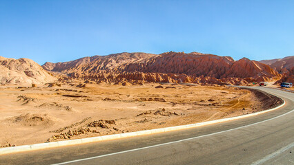Asphalt road through Atacama Desert near San Pedro de Atacama, Chile