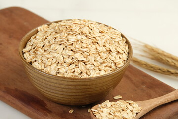 rolled oat or oat  flakes in a bowl