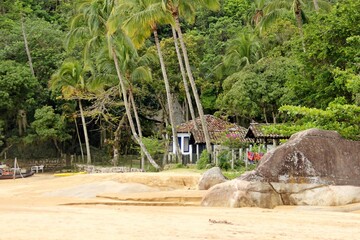 Tropical beach with lush vgetation and old house colonial style in Jabaquara beach, Brazil