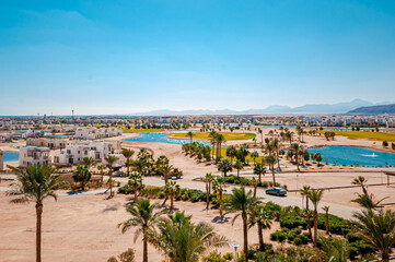 view of oasis with lake and desert