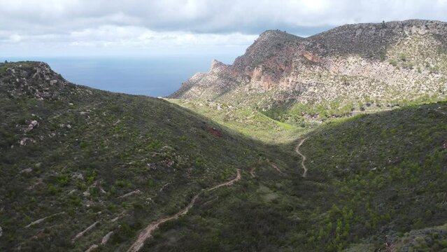 Scenic drone footage of the Coll de Sa Gramola, Mallorca. Fascinating aerial views of landscape, mountains, rocks and seaside.