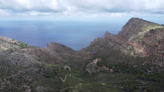 Scenic drone footage of the Coll de Sa Gramola, Mallorca. Fascinating aerial views of landscape, mountains, rocks and seaside.
