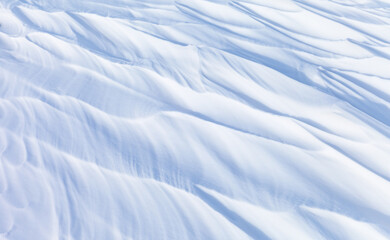 Natural winter snow texture of frozen Baikal Lake in cold day. Abstract white textured background...
