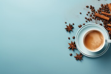 Indian Masala chai tea. Traditional Indian hot drink with milk and spices on light blue background. Autumn and winter drink. Flat lay, top view with copy space