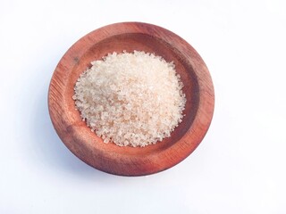 granulated sugar in a wooden bowl isolated on a white background. cooking spices. sweet granules.