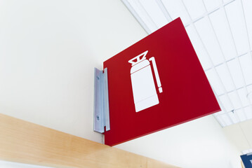 fire extinguisher against a white wall, symbolizing safety and preparedness in case of emergency, with copy space