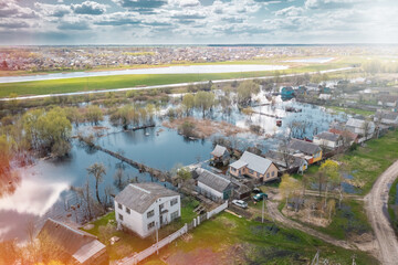 Flooded private houses in spring in countryside