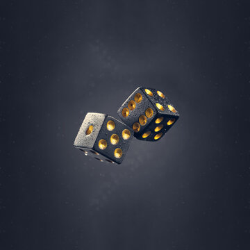 Two black dice are falling on a dark gray background. Photo with bokeh.