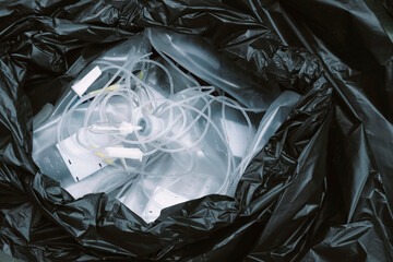 Close-up of toxic waste in garbage bags, acetate ringer's injection, saline bottles and Syringes,...