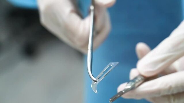 surgical instruments prepared and build up by female dental assistant in the operating room.