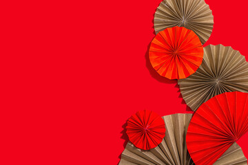 Happy Chinese New Year traditional concept. Oriental asian style paper fans on red background