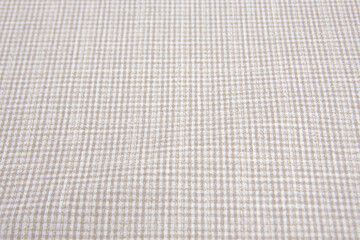 Classic brown cotton fabric textured background. Expensive men's suit fabric.Check is made of...