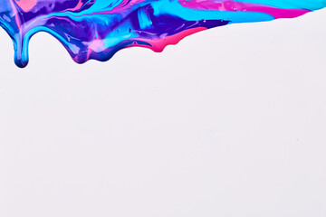 Acrylic multicolor paint blot, chaotic brushstroke, spot flowing on white paper background. Creative blue color backdrop, fluid art.