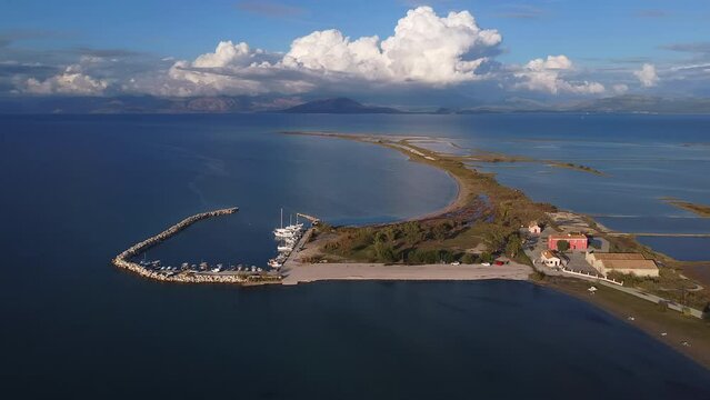 Aerial view of Corfu, Greece landscape, close to Lefkimi city, spectacular white clouds and blue sea.