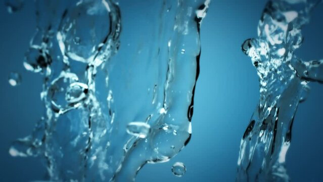 Crystal clear spring water splash on blue background. Pure clean water splash on blue background