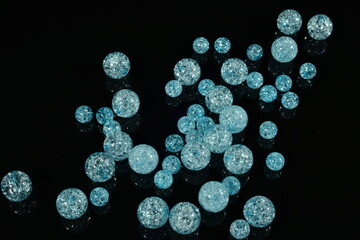 blue beads balls on black mirror background