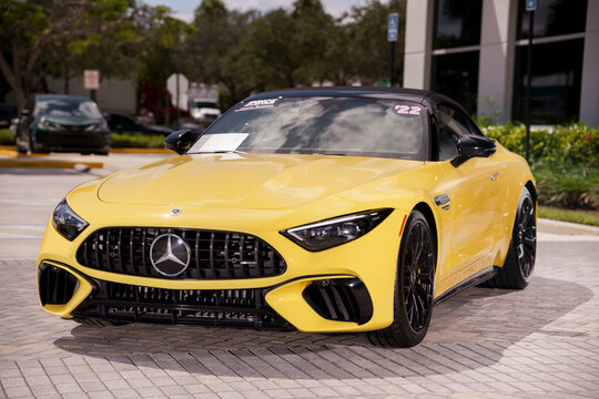 Stock image of a yellow 2022 Mercedes Benz AMG SL Roadster Roadster