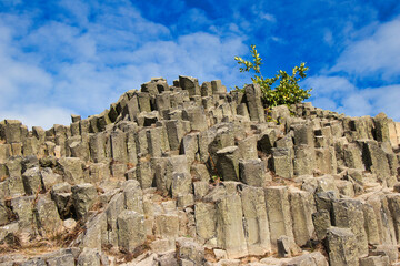Detail view of rock formation called "Panska skala" with pentagonal and hexagonal basalt columns. Close to Kamenicky Senov town. Czech Republic