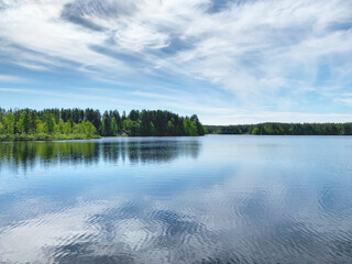 Landscape with a lake and a forest in Murmansk Oblast, Russia, June 2019