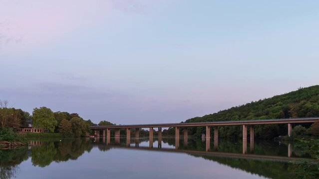 4k timelapse video of sunrise on the highway across Lake Seilersee in Iserlohn, Germany