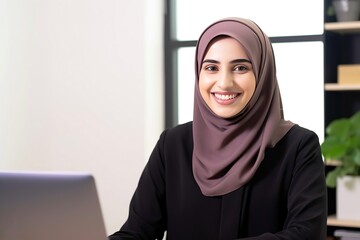 Muslim woman working in home office.  - obrazy, fototapety, plakaty
