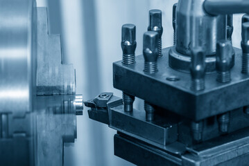 Close up scene the lathe machine rough cut  metal tube parts.