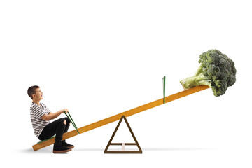 Boy and a broccoli vegetable on a seesaw