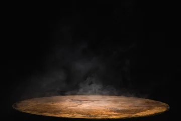 Foto op Plexiglas Empty old circular wooden table with smoke float up on dark background © Thitiwat.Day