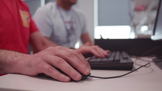 Office workers using computer mouse and keyboard technology startup