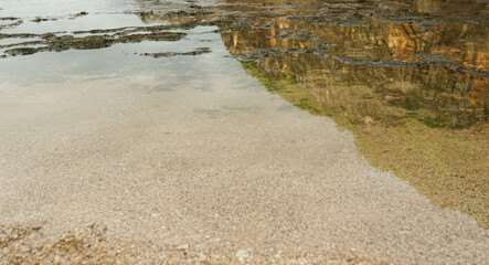 the atmosphere of low tide and beach sand in the morning