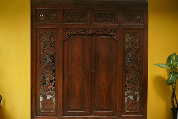 Traditional carved wooden door with beautiful and extraordinary details