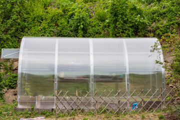 greenhouse close-up stands in the garden  