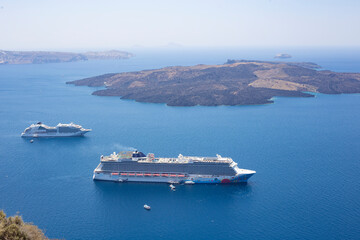 Big ferry boat sailing across the bay in Santorini, Greece - obrazy, fototapety, plakaty